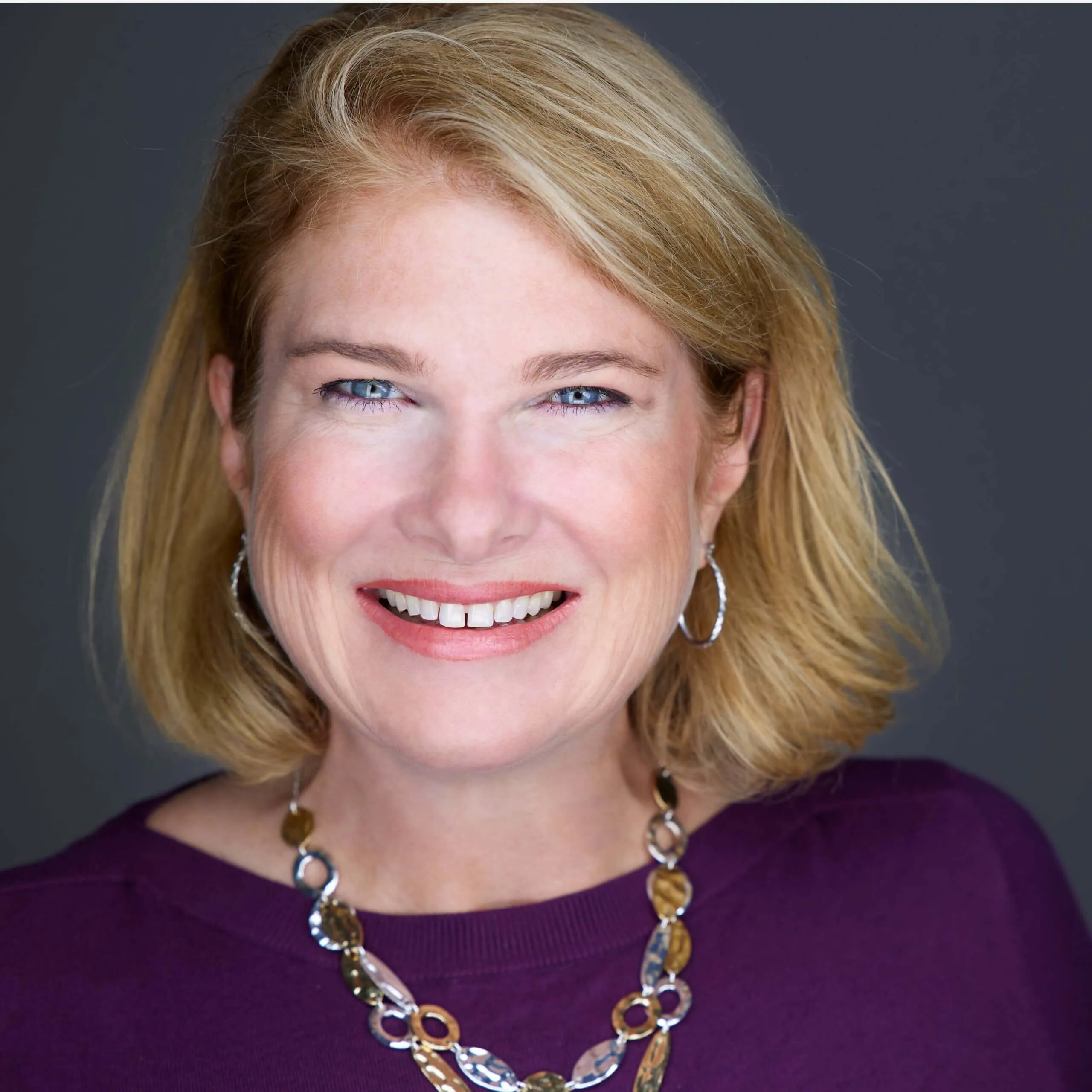 Professional headshot of Robyn Binger, Atlanta metro realtor. Nomo Web Media setup and optimized her Google Business Profile to improve visibility